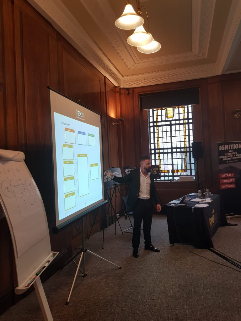 Andy Whitehead presenting to a room of recruitment firm owners
