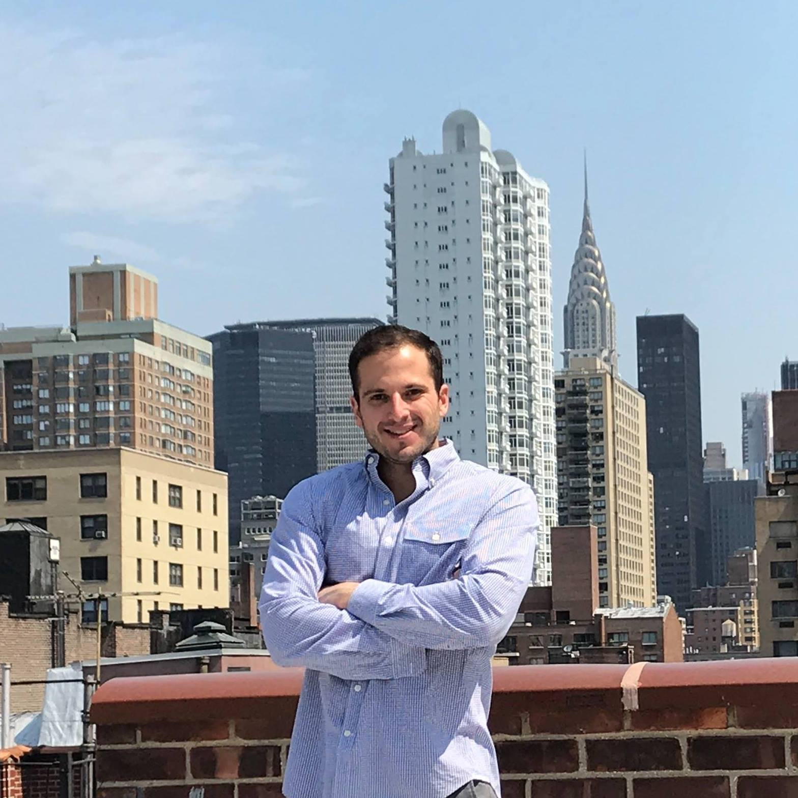 Jonathan Spiess, Rocket Talent, on a rooftop above the New York skyline